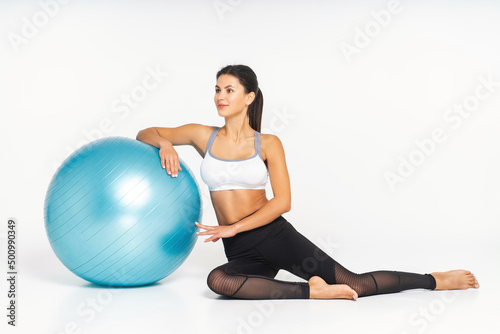 Fitness woman working out with pilates ball, relax and resting after workout