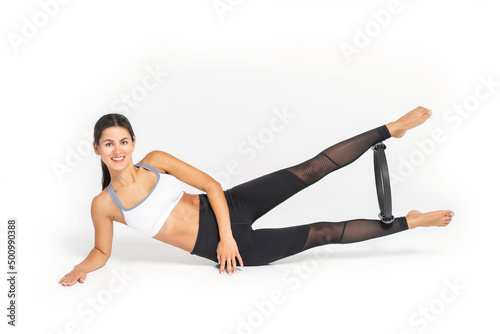 one caucasian woman exercising pilates fitness elastic resistance band exercises isolated on white background