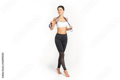 Fitness woman with resistance band on white background. Athletic girl working out