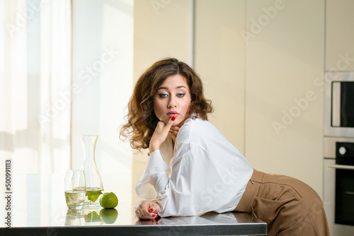 Young caucasian woman with green apple and water healthy diet