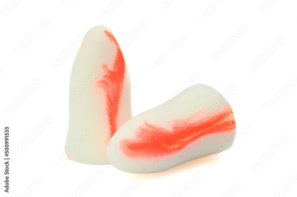 White-orange earplugs isolated on white background.Close-up.Soft foam earplug White-orange earplugs isolated on white background.Close-up.Soft foam earplug