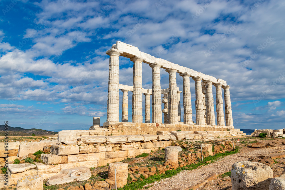Temple of Poseidon with blue sky and clouds, Sounion, Greece