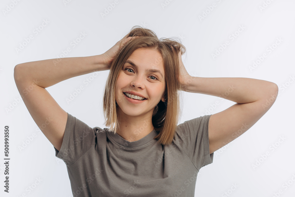 portrait of a young beautiful girl with braces, on a white background portrait of a young beautiful girl with braces, on a white background