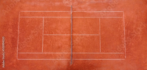 Aerial view of clay tennis courts located in a green park and used for exercise and preparation of athletes and recreationists