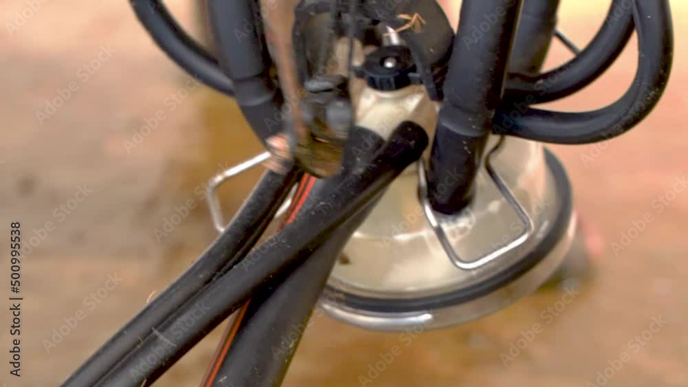 Machine Milking Cows on a Farm. Automated Milking Machine Controlled by a Computer. Industrial Milk Production. Cows are in the Pen Machine Milking Cows on a Farm. Automated Milking Machine Controlled by a Computer. Industrial Milk Production. Cows are in the Pen