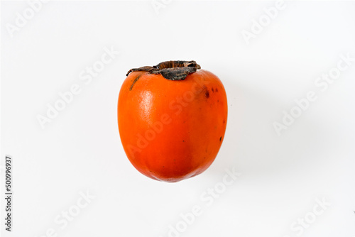 Persimmon fruit isolated on white background photo