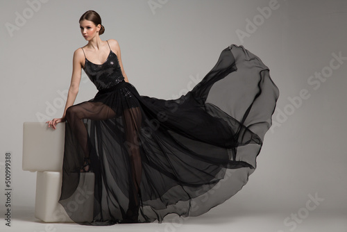 Tela woman in a long black dress