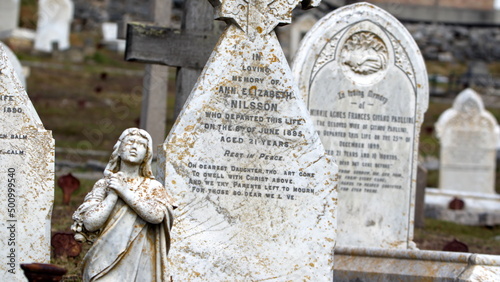 Historic tombstone in a graveyard in Stanley, Falkland Islands photo