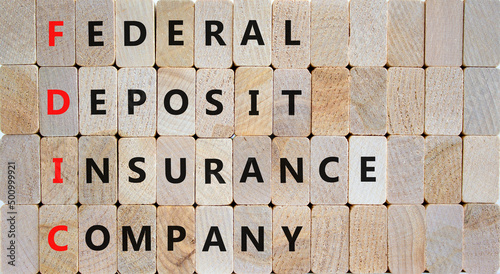 FDIC federal deposit insurance corporation symbol. Concept words FDIC federal deposit insurance corporation on blocks on wooden background. Business FDIC federal deposit insurance corporation concept. photo