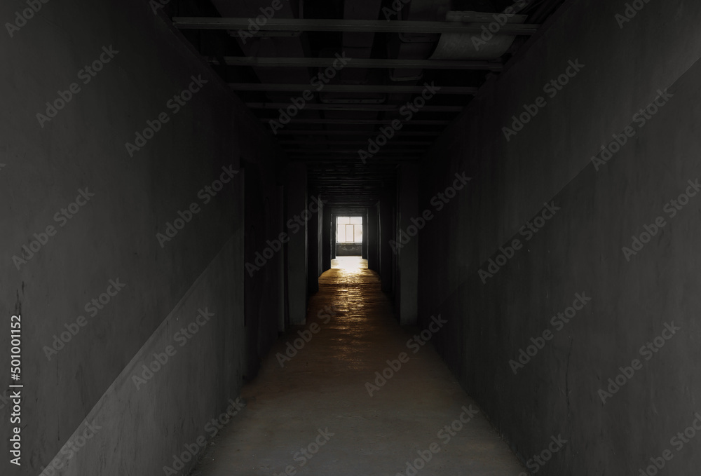 A dark long corridor at the end of the world of hope. 