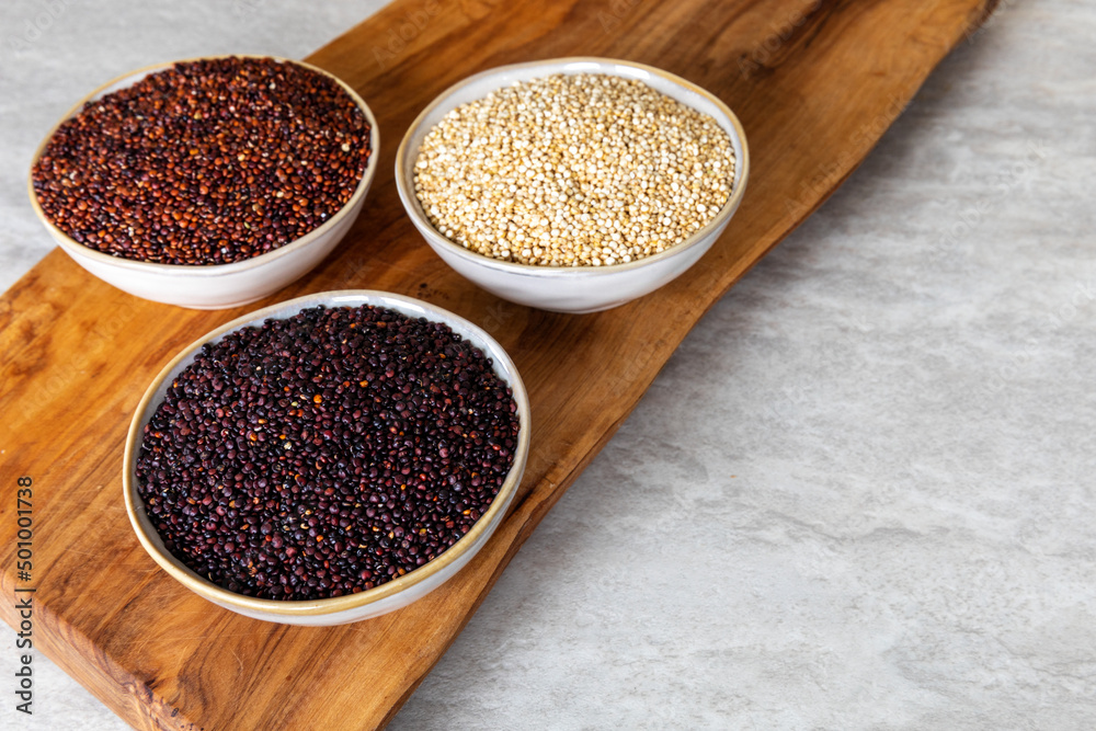 Quinoa of different colors: white, red and black in a bowl. Healthly gluten free grains. Quinoa of different colors: white, red and black in a bowl. Healthly gluten free grains.
