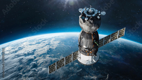 Fototapeta Naklejka Na Ścianę i Meble -  Russian spaceship on orbit of Earth. Sunlight and sky with clouds on background. Spacecraft in outer space. Sci-fi wallpaper. Elements of this image furnished by NASA
