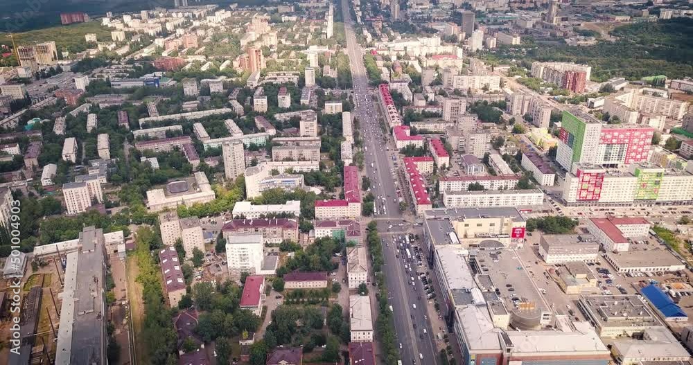 Aerial view of urban skyline of a modern city with site development and busy crossroads and streets Aerial view of urban skyline of a modern city with site development and busy crossroads and streets