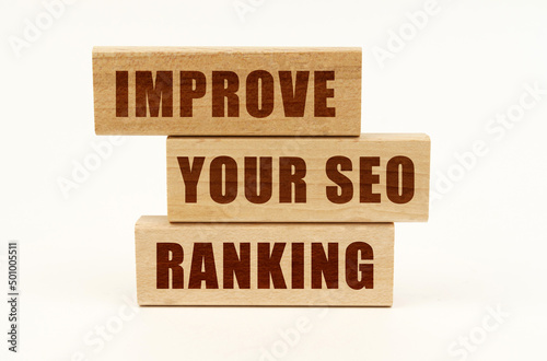 On a white surface are wooden blocks with the inscription - Improve Your Seo Ranking