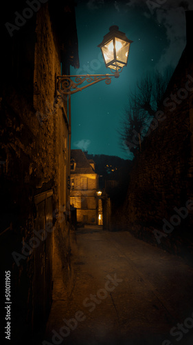 Street of Sarlat la Caneda in the evening with the moon, Dordogne - France