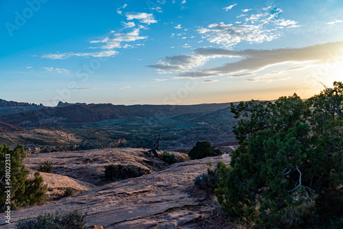 Sunset at Arches National Park over the mountain that leads to the Delicate Arch