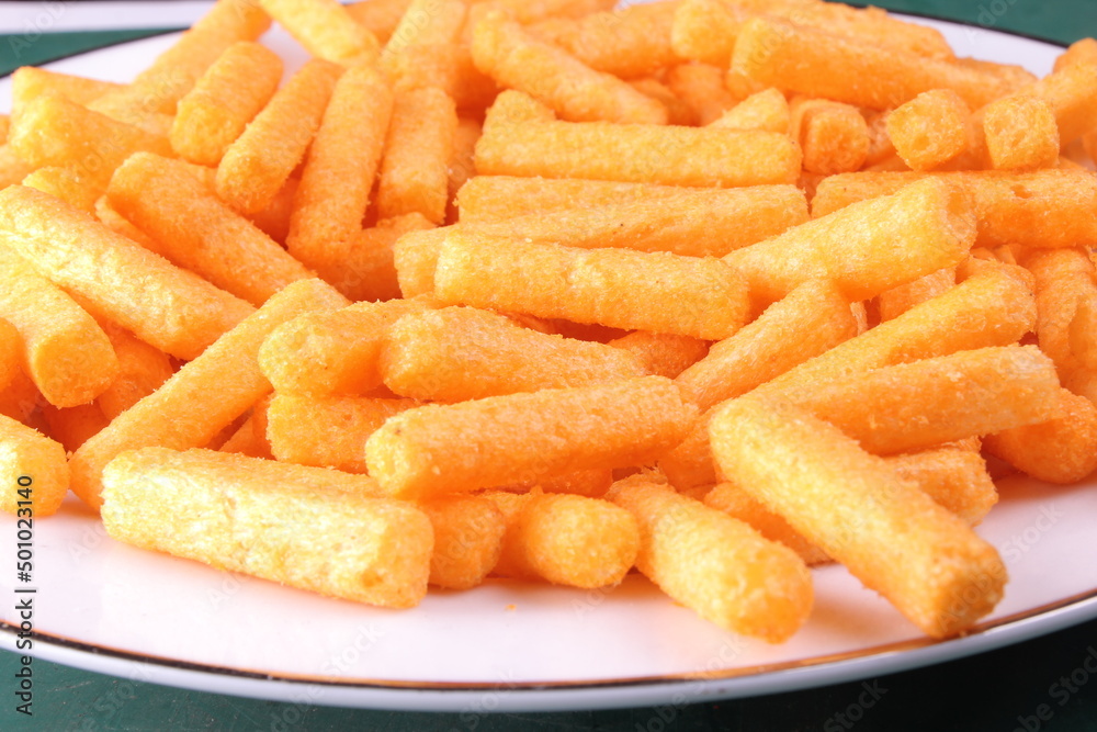 Close up photo of a pile of balado sticks on a white plate. selective focus Close up photo of a pile of balado sticks on a white plate. selective focus
