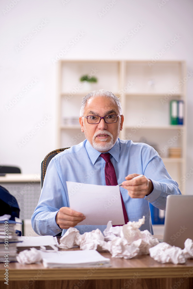 Old male employee in brainstorming concept Old male employee in brainstorming concept