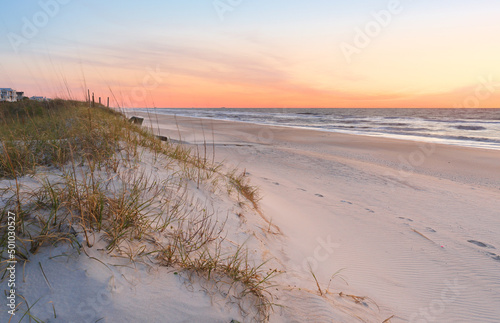 Fototapeta Naklejka Na Ścianę i Meble -  Beautiful sunrise over Kure Beach, Kure Beach, North Carolina USA. Kure Beach is a town 15 miles south of Wilmington, North Carolina