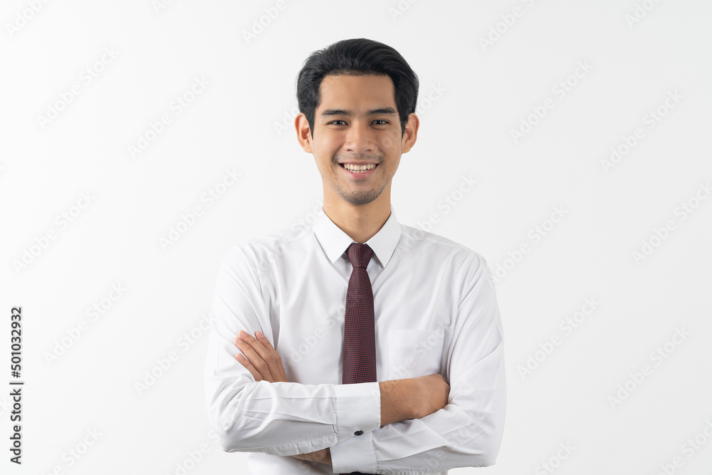 happy young asian businessman smiling and folded arms in formal suit isolated on white background. happy young asian businessman smiling and folded arms in formal suit isolated on white background.