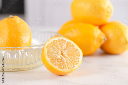 A Lemon Being Juiced on a Kitchen Counter