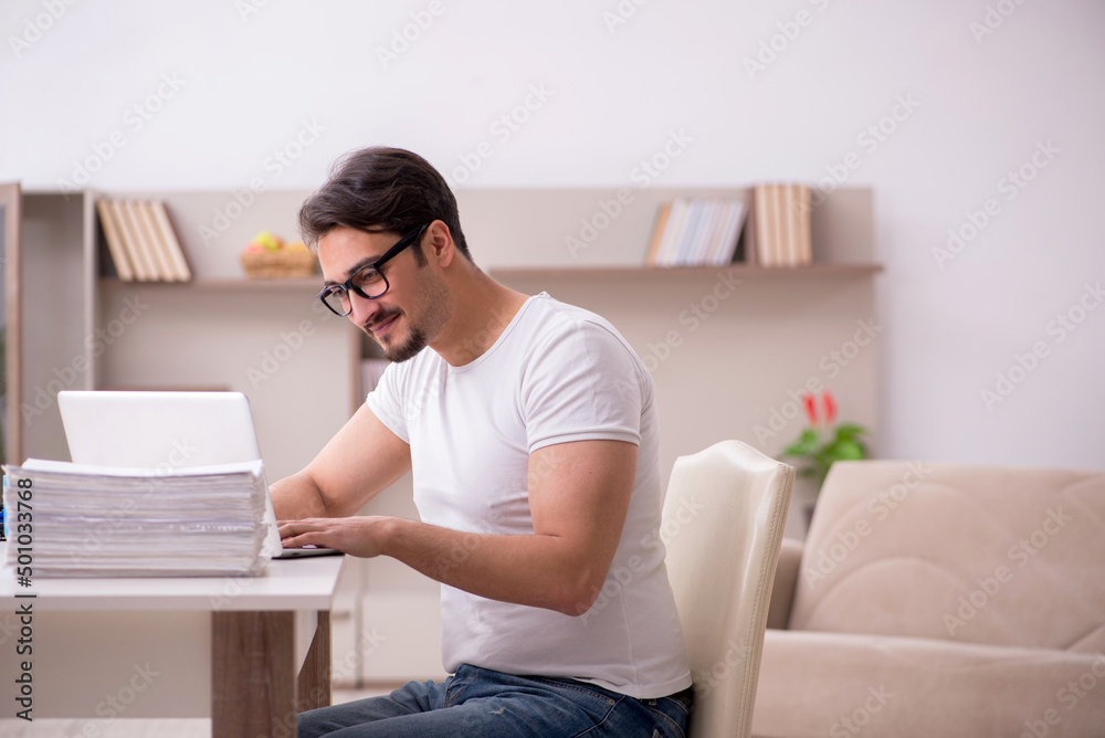 Young male freelancer working from home Young male freelancer working from home