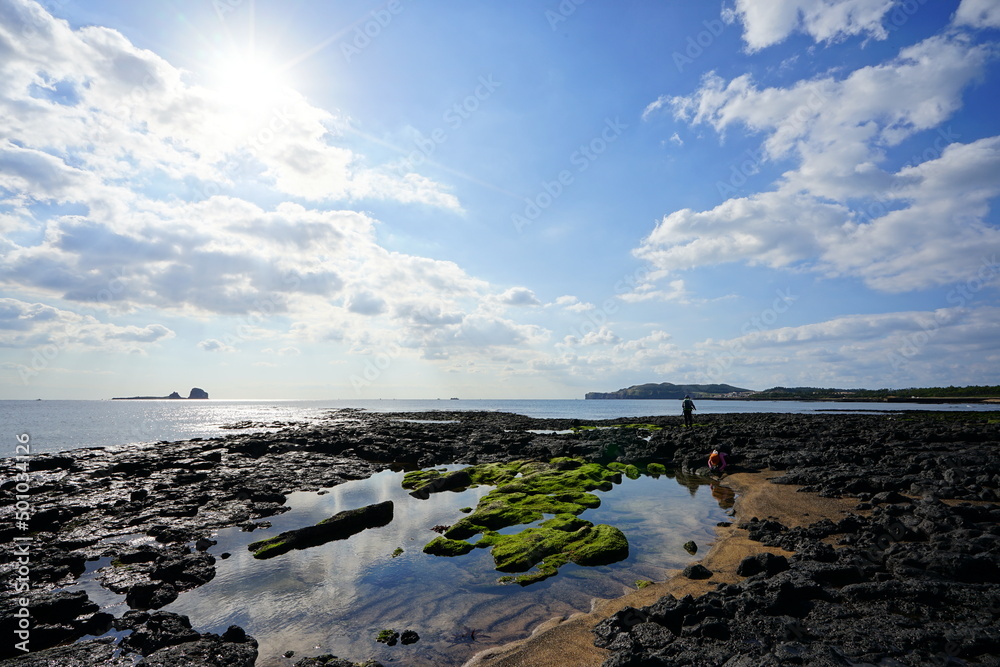 beautiful moss rock beach and fine clouds beautiful moss rock beach and fine clouds