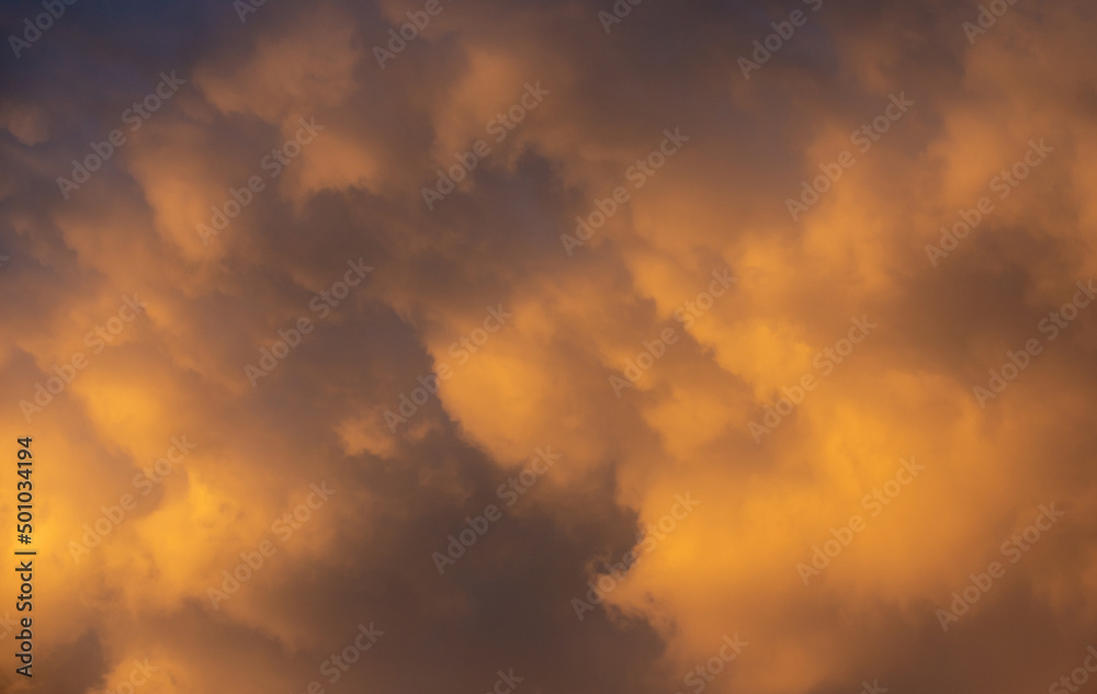 a close-up of yellow clouds in the evening