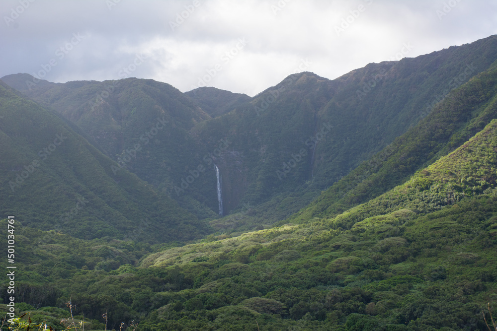 Waterfall deep in the lush Halawa Valley on Molokai Island in Hawaii.