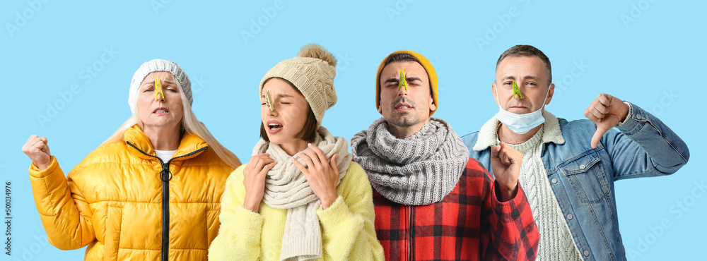 Ill people with clothespins on their noses against light blue background
