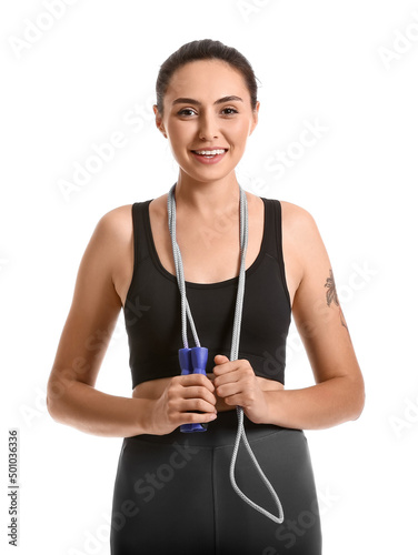 Sporty young woman with ski...