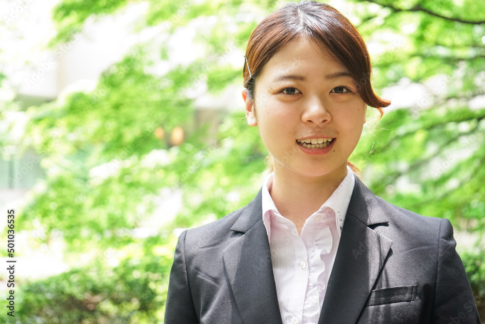Businesswoman walking outdoors with smile Businesswoman walking outdoors with smile
