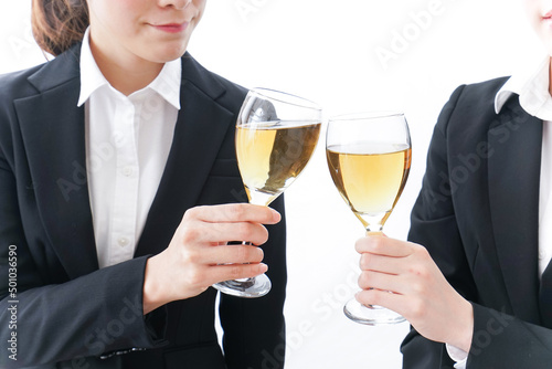 Young businesswomen in drinking parties