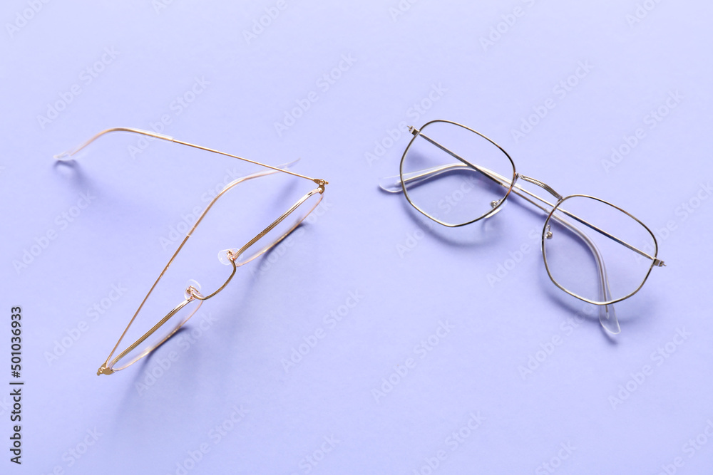 Different stylish eyeglasses on lilac background Different stylish eyeglasses on lilac background