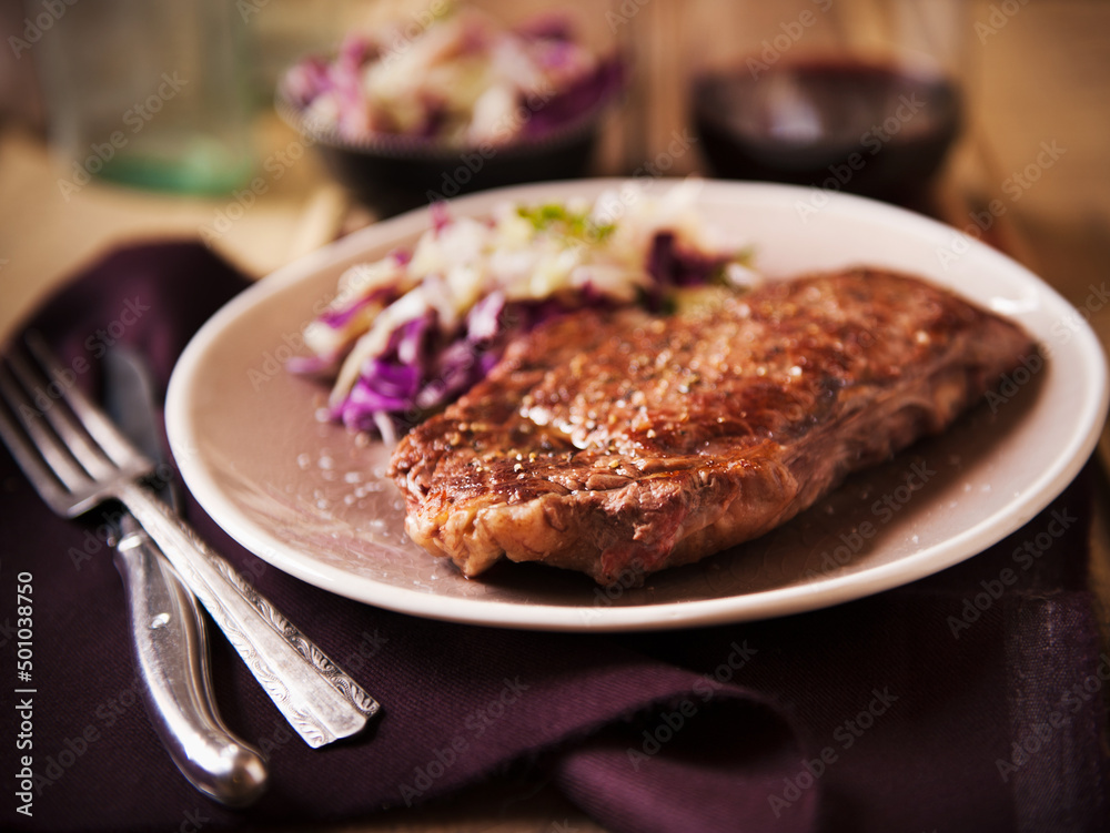Grass Fed Rib-Eye Steak Served with Cabbage Salad and Red Wine Grass Fed Rib-Eye Steak Served with Cabbage Salad and Red Wine