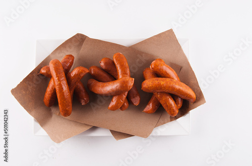 Many Smoked Sausages om Paper; From Above