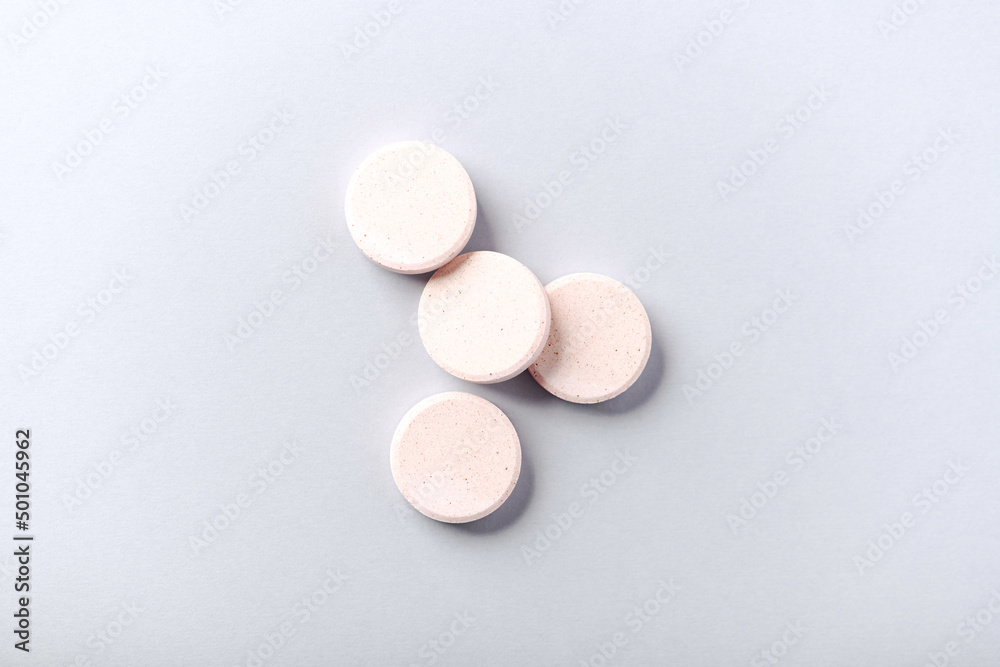 Collagen effervescent Tablets. Supplement to support collagen production. Bright paper background. Soft focus. Close up. Copy space. Collagen effervescent Tablets. Supplement to support collagen production. Bright paper background. Soft focus. Close up. Copy space.