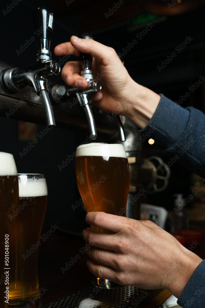 bartender pouring beer
