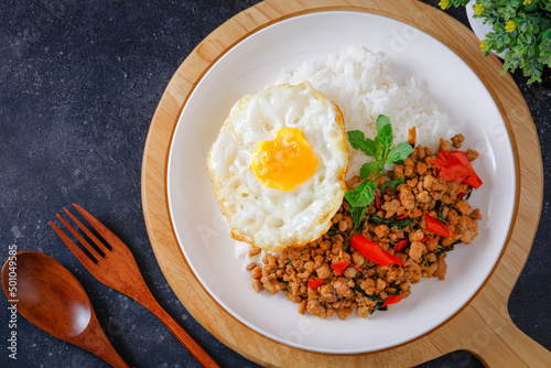 Thai food, stir-fried basil with pork and fried egg Popular food of Thailand, original Thai food concept.