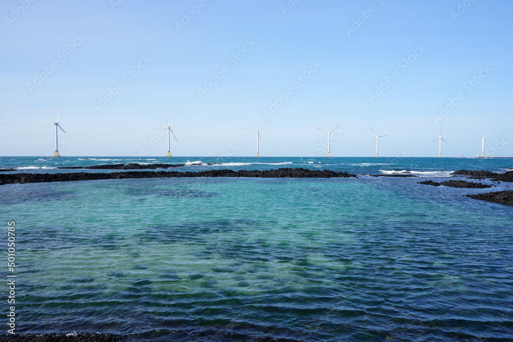 wonderful seascape with distant turbine on the sea
