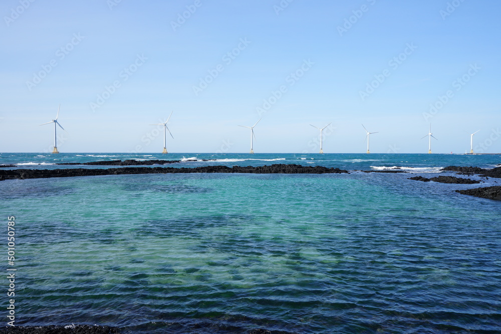 Obraz premium wonderful seascape with distant turbine on the sea