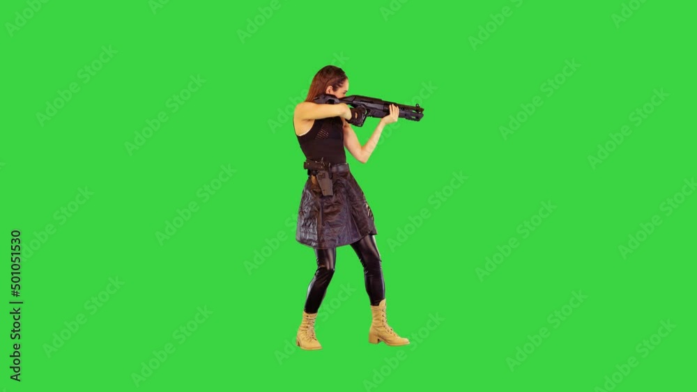 Girl with a gun searches for aim and makes a single shot on a Green Screen, Chroma Key. Girl with a gun searches for aim and makes a single shot on a Green Screen, Chroma Key.
