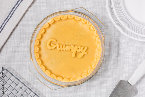 Fotografie Gooseberry pie with Grumpy sign on it, popular dish from fairytale Snow white an