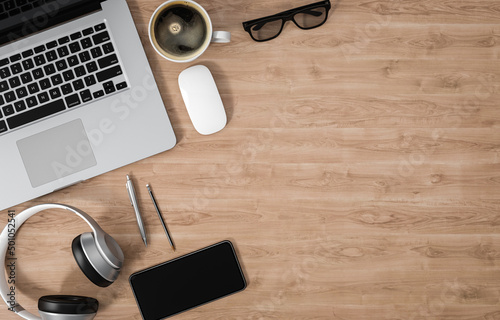 Laptop, smartphone and other devices on wood office desk, copy space, 3d rendering