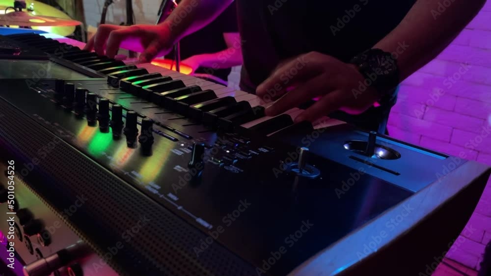 Keyboard playing while drums in back Keyboard playing while drums in back