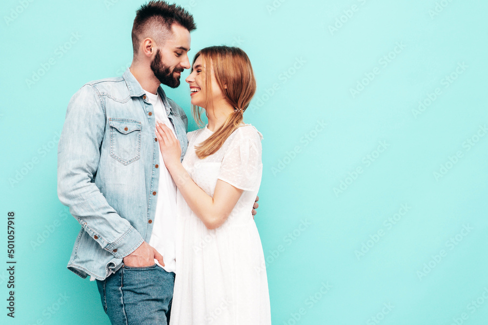 Sexy smiling beautiful woman and her handsome boyfriend. Happy cheerful family having tender moments near white wall in studio.Pure cheerful models hugging.Embracing each other. In sunglasses Sexy smiling beautiful woman and her handsome boyfriend. Happy cheerful family having tender moments near white wall in studio.Pure cheerful models hugging.Embracing each other. In sunglasses