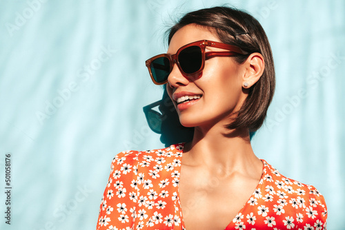 Fotografía Young beautiful smiling female in trendy summer red dress