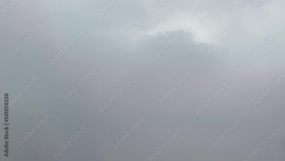 Aircraft passing through dark clouds during descent over Florida. Window view. Aircraft passing through dark clouds during descent over Florida. Window view.