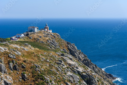View of Cape Finisterre Lighthouse at Costa da Morte or Death Coast at Fisterra, Coruna, Spain photo