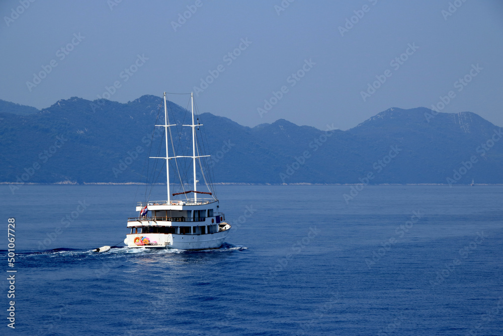 view over the sea and a boat taken from the ferry to the island Mljet, croatia